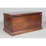 A late George III mahogany document trunk, the hinged lid enclosing two adjustable dividers, the