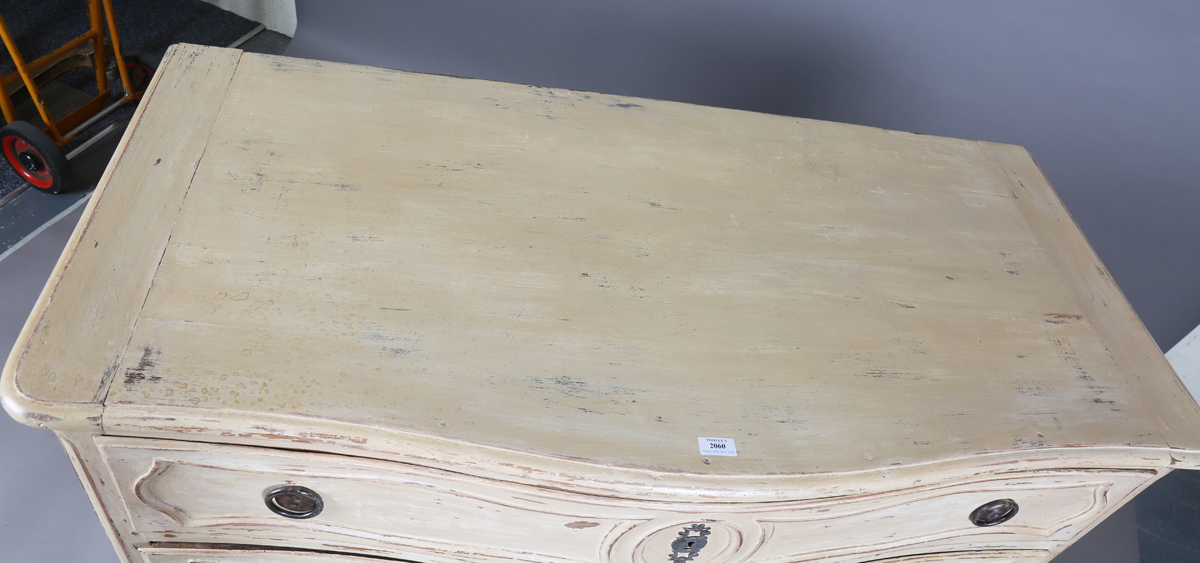 An 18th century French cream painted walnut serpentine fronted three-drawer commode, on carved squat - Image 11 of 11