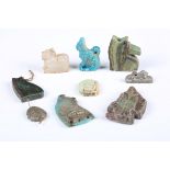 A group of eight Egyptian faience amulets, including two Udjat-eye amulets, a fish plaque amulet,