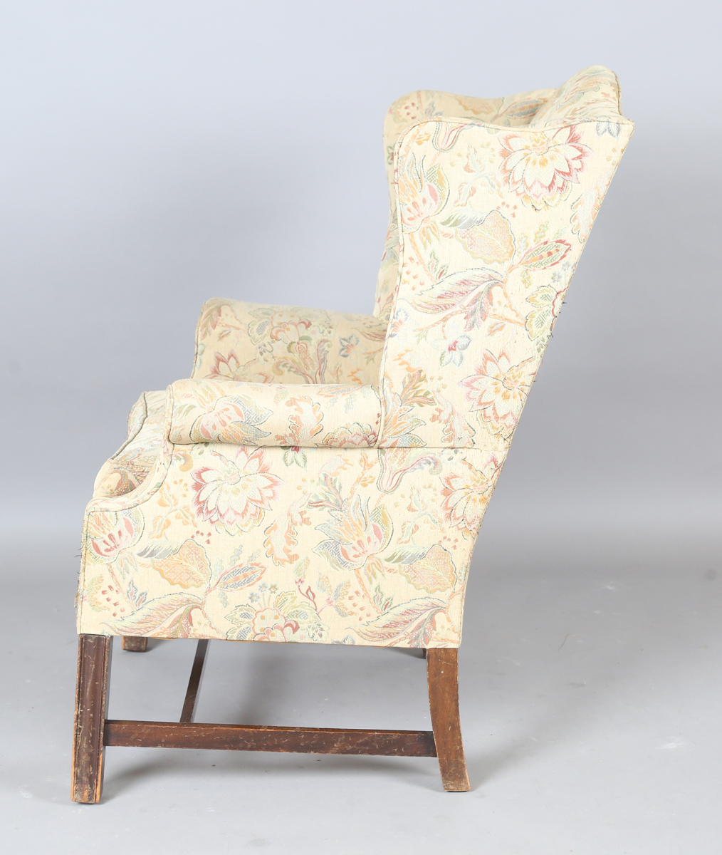 A 20th century George III style wingback armchair, upholstered in foliate machined tapestry style - Image 3 of 12