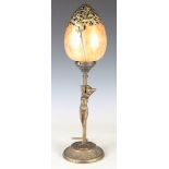 A modern cast brass figural table lamp with a Heron glass ovoid shade, height 46cm.Buyer’s Premium