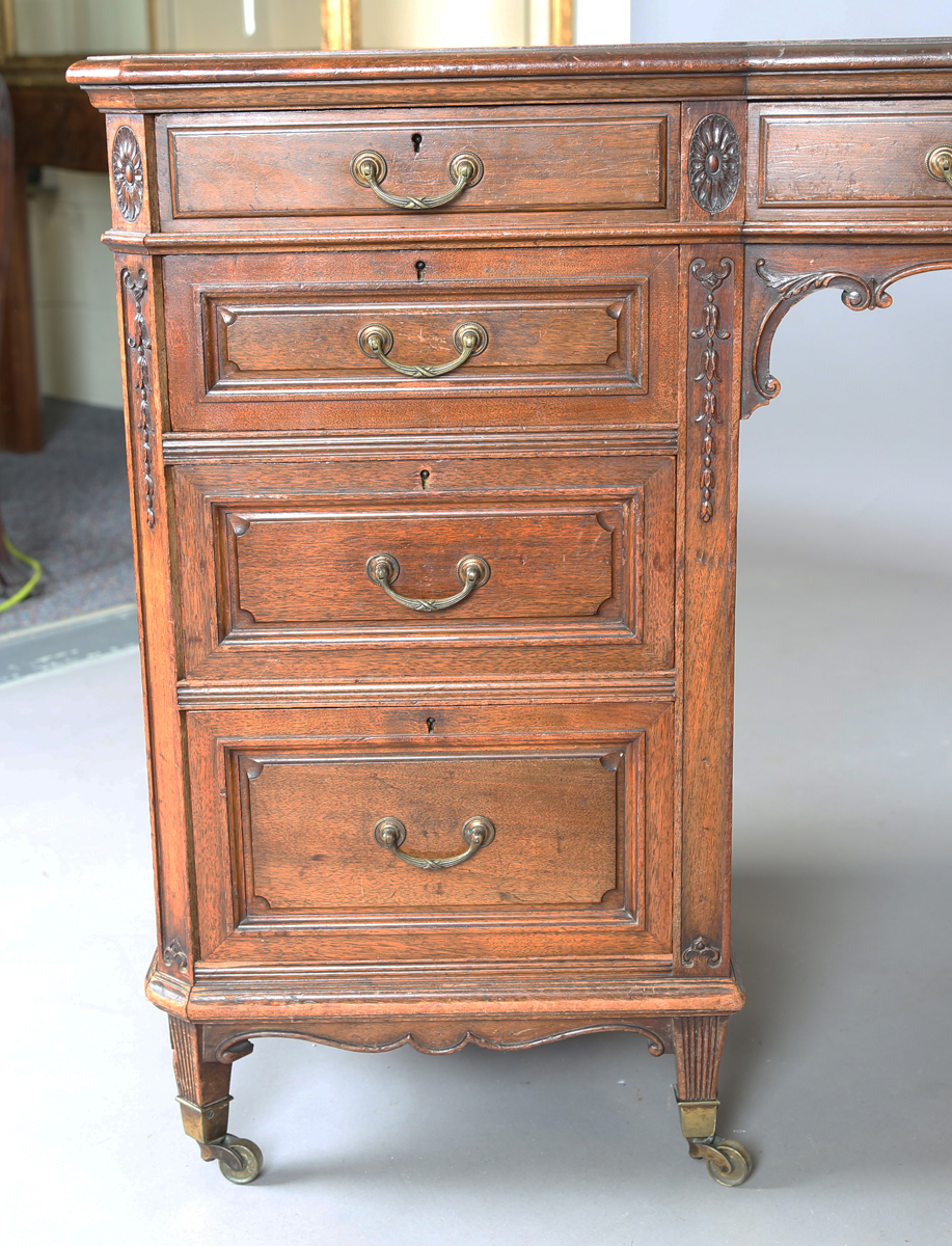 An Edwardian walnut twin pedestal desk by Gillows of Lancaster, the breakfront top inset with - Image 7 of 12