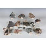 A collection of mineral specimens, including a split rhyolite agate and quartz geode, brochantite,