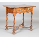 A Queen Anne walnut lowboy, fitted with a single drawer, on turned legs united by an 'X' framed