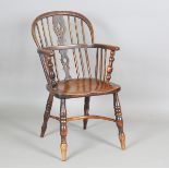 A 19th century ash and elm Windsor armchair with crinoline stretcher, height 90cm, width 53cm, depth