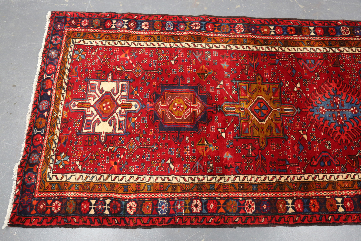 A Heriz runner, North-west Persia, mid/late 20th century, the red field with a column of shaped - Image 7 of 7