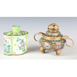 A Chinese enamel tea caddy, decorated with birds and flowers against a green quatrelobed ground,