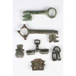 A group of medieval items, including two verdigris keys, lengths 10cm and 8.5cm, a base metal