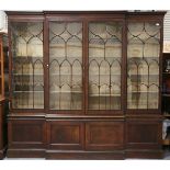 An early 20th century George III style mahogany breakfront library bookcase, height 234cm, width