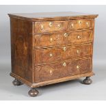 A William and Mary walnut and marquetry inlaid chest of two short and three long drawers, raised