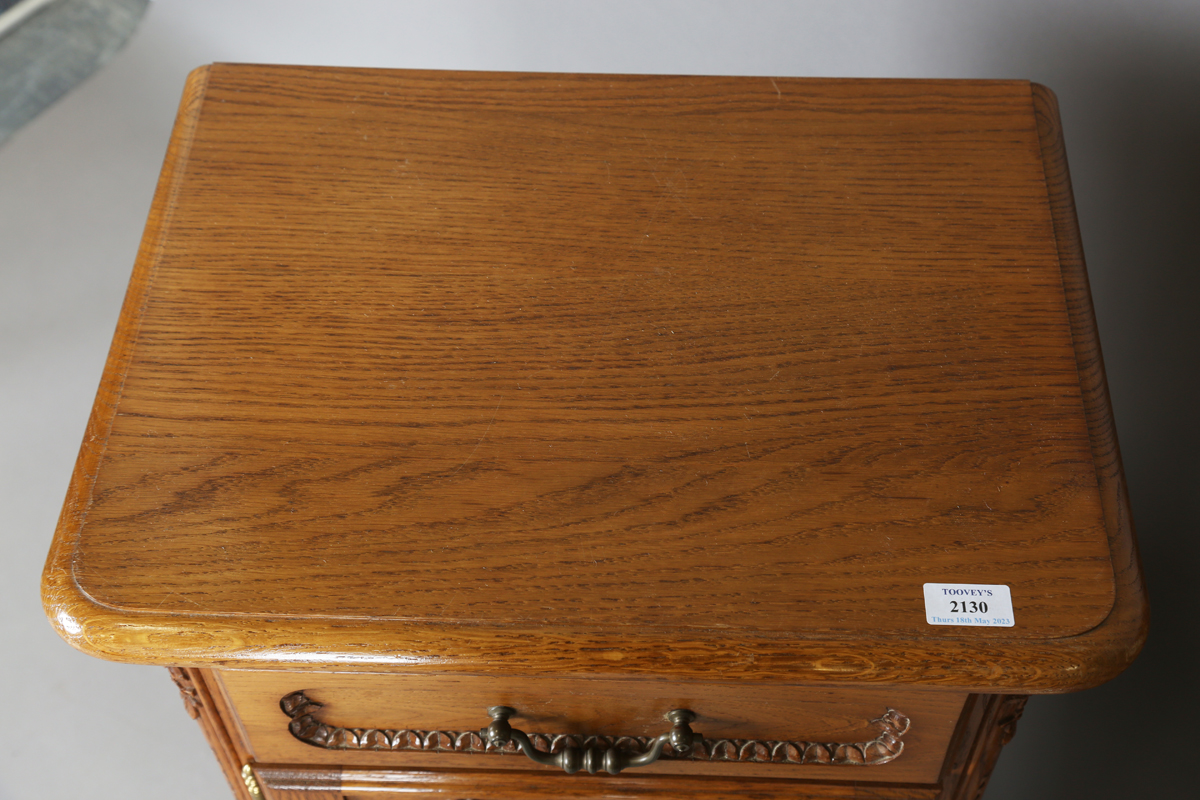 A pair of late 20th century French oak bedside cabinets, each fitted with a finely carved drawer and - Image 17 of 17