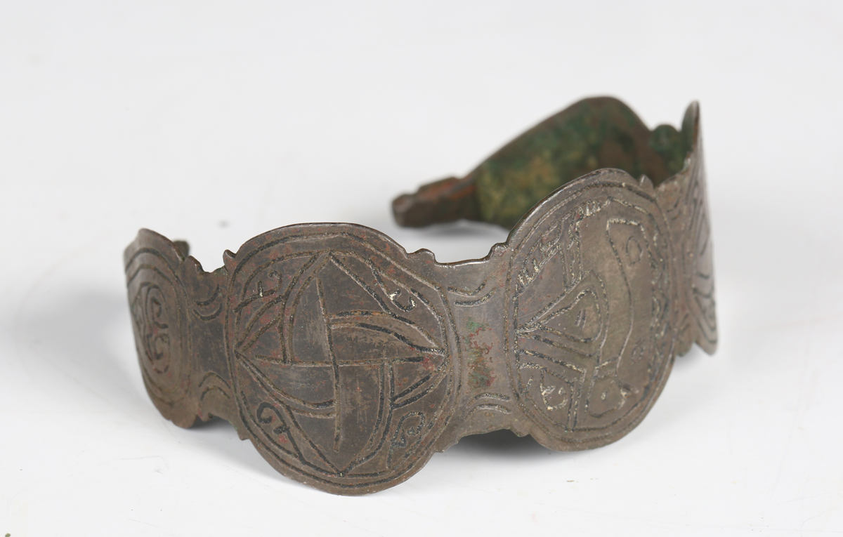 A European Saxon bronze bracelet, engraved with bird and geometric design, width 6.2cm.