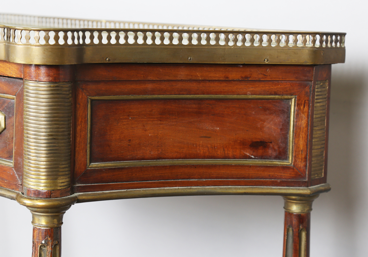 A French Empire mahogany and gilt metal mounted console table, the shaped top inset with white - Image 7 of 20