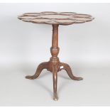 A late George III mahogany tip-top supper table, the top later carved with a central roundel
