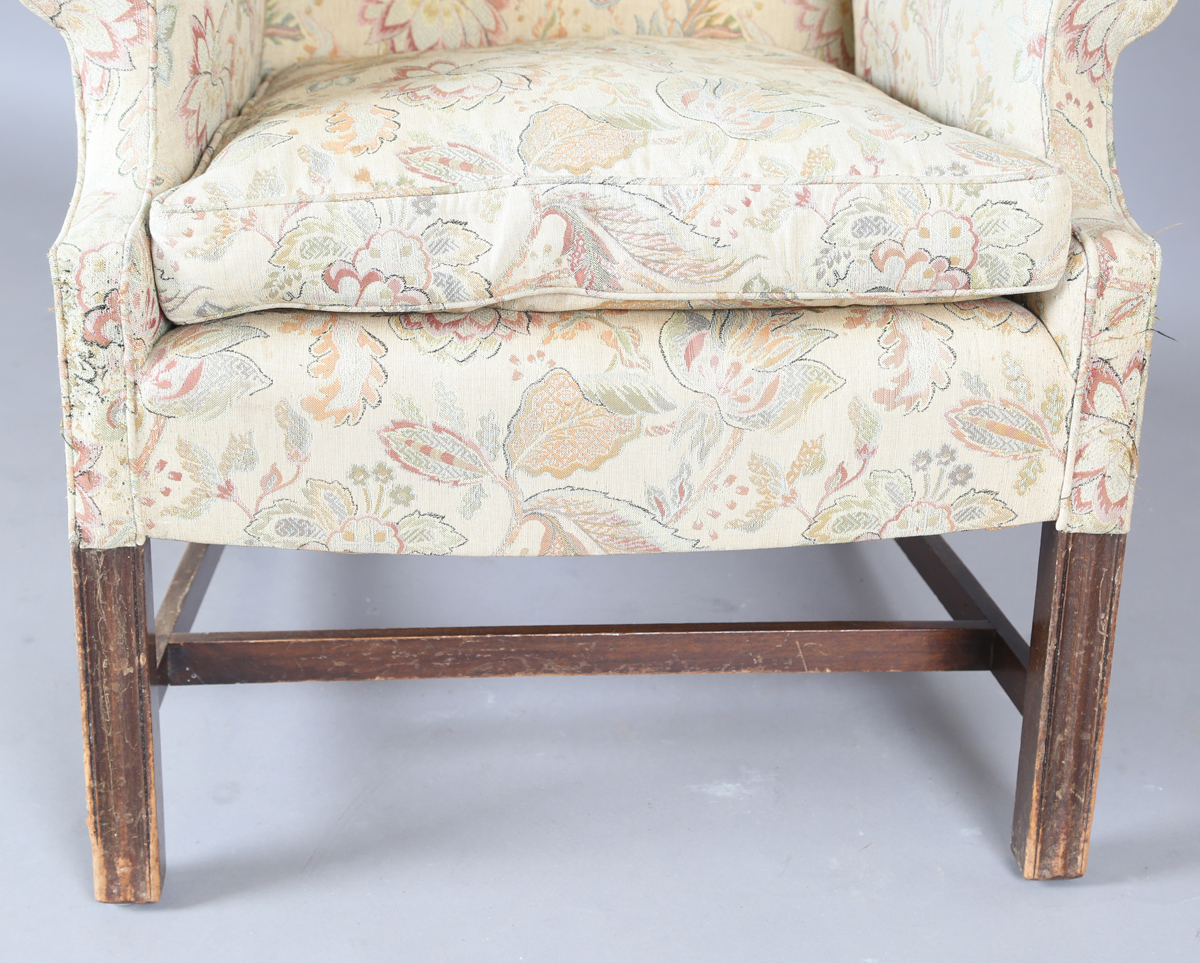 A 20th century George III style wingback armchair, upholstered in foliate machined tapestry style - Image 7 of 12