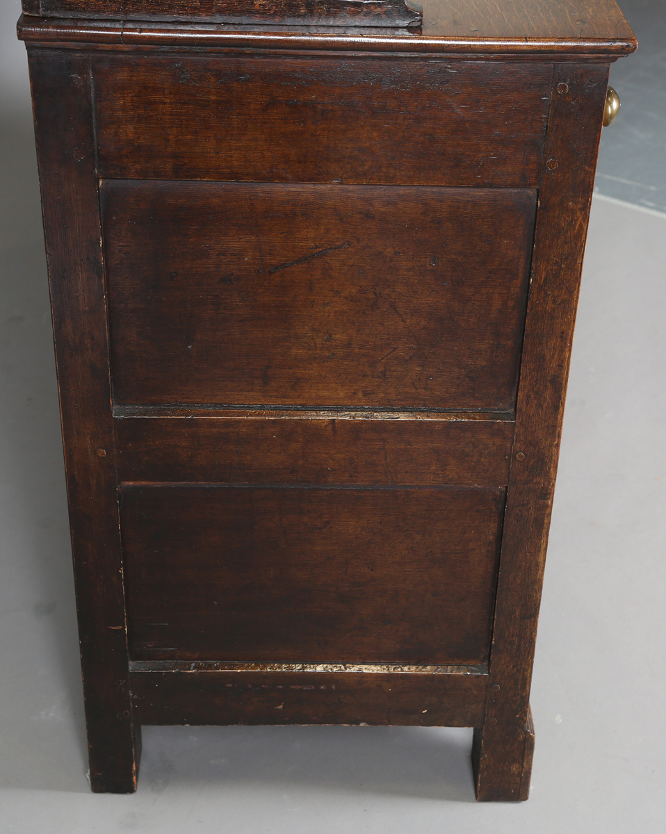 A late George III provincial oak dresser, the shelf back with blue painted backboards, the base with - Image 5 of 9