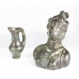 A Roman green patinated bronze head and shoulders bust of a lady, length 6cm, together with a votive