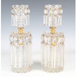 A pair of early/mid-19th century cut glass table lustres, each sconce above a gilt metal mounted