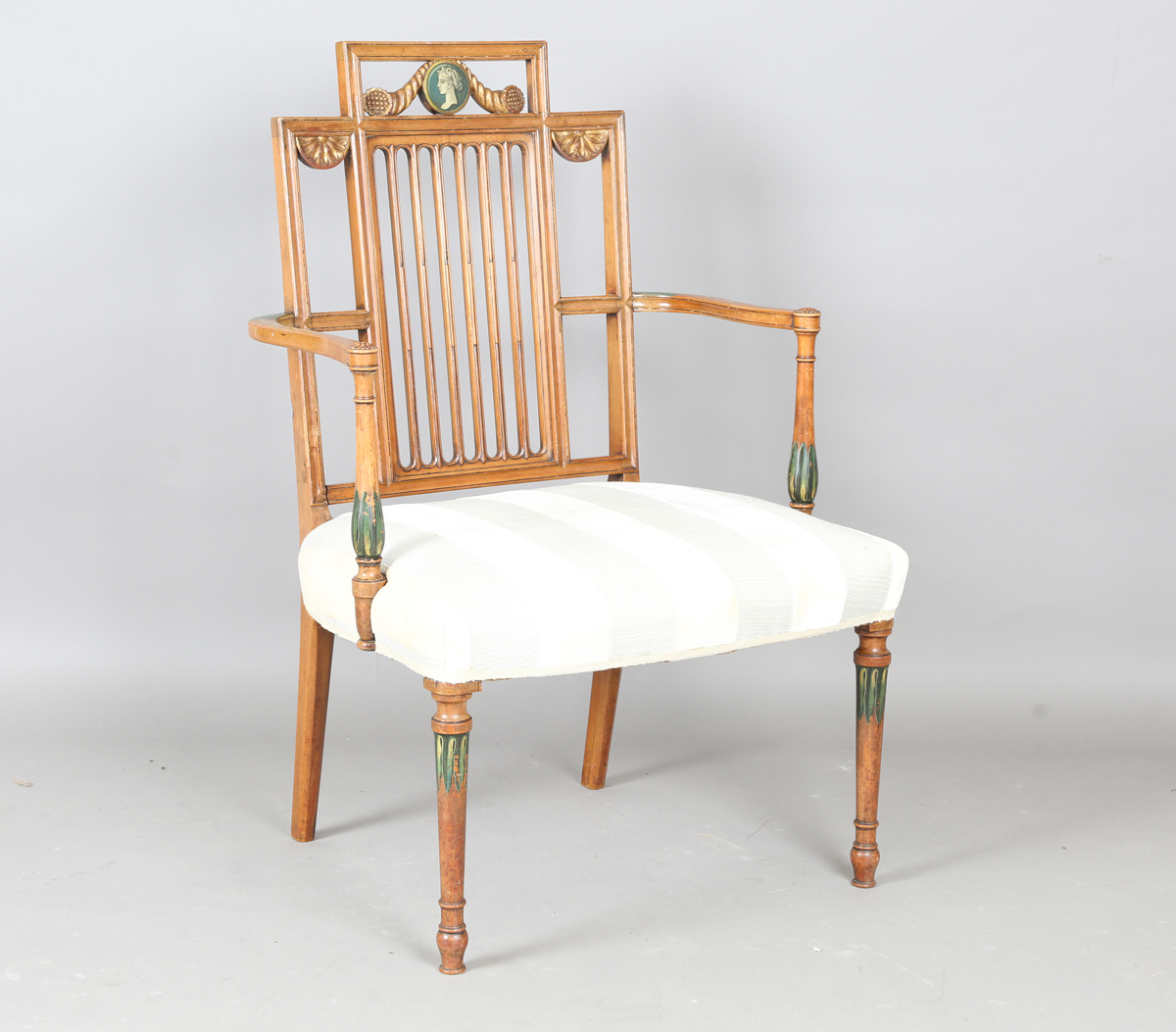 An early 20th century Neoclassical Revival satin walnut armchair, painted with portrait medallion