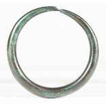A European Romano-Celtic patinated bronze bracelet with incised decoration, diameter 8cm. Note: from