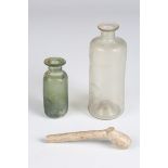 Two 18th century glass phials, possibly English, heights 10cm and 6.5cm, together with a fragment of