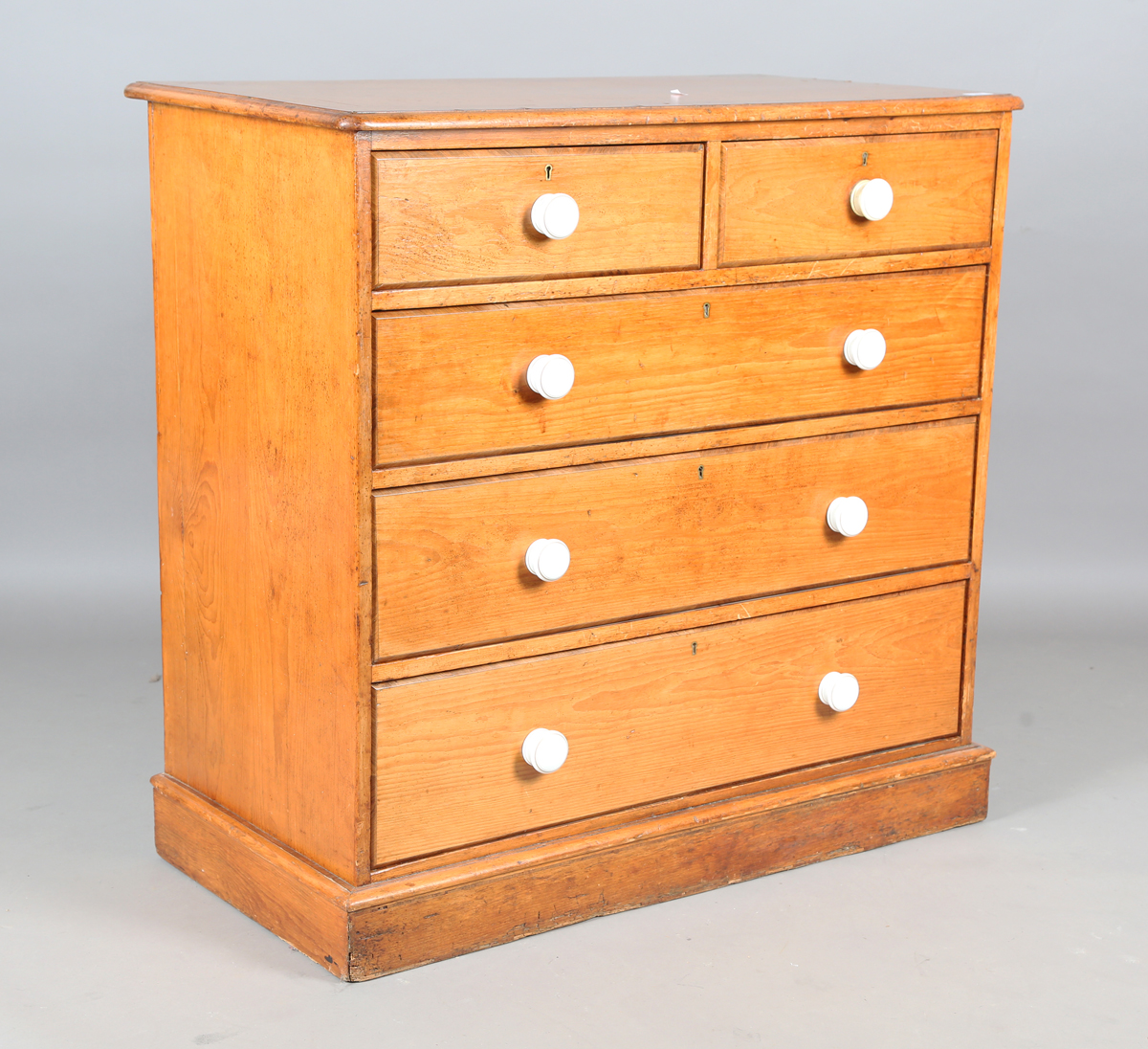 A mid-Victorian pine chest of drawers, the top with kingwood crossbanding, the drawers with later