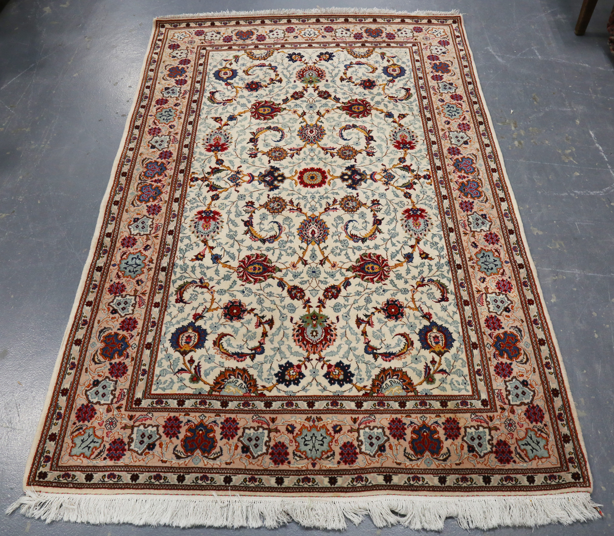 A Tabriz rug, Central Persia, late 20th century, the ivory field with overall scrolling tendrils