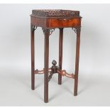 A George III Chippendale period mahogany kettle stand, the pierced gallery top above a pull-out
