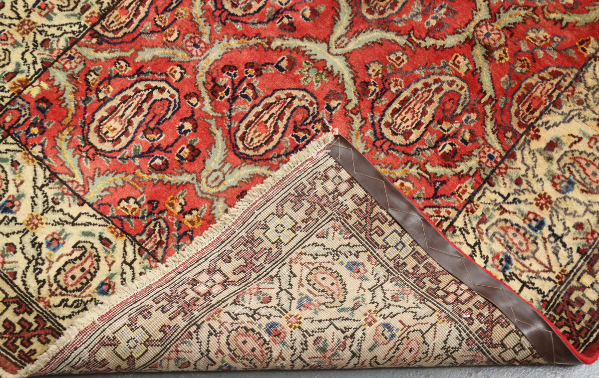 A Tabriz rug, Central Persia, mid/late 20th century, the red field with a boteh lattice, within an - Image 2 of 6