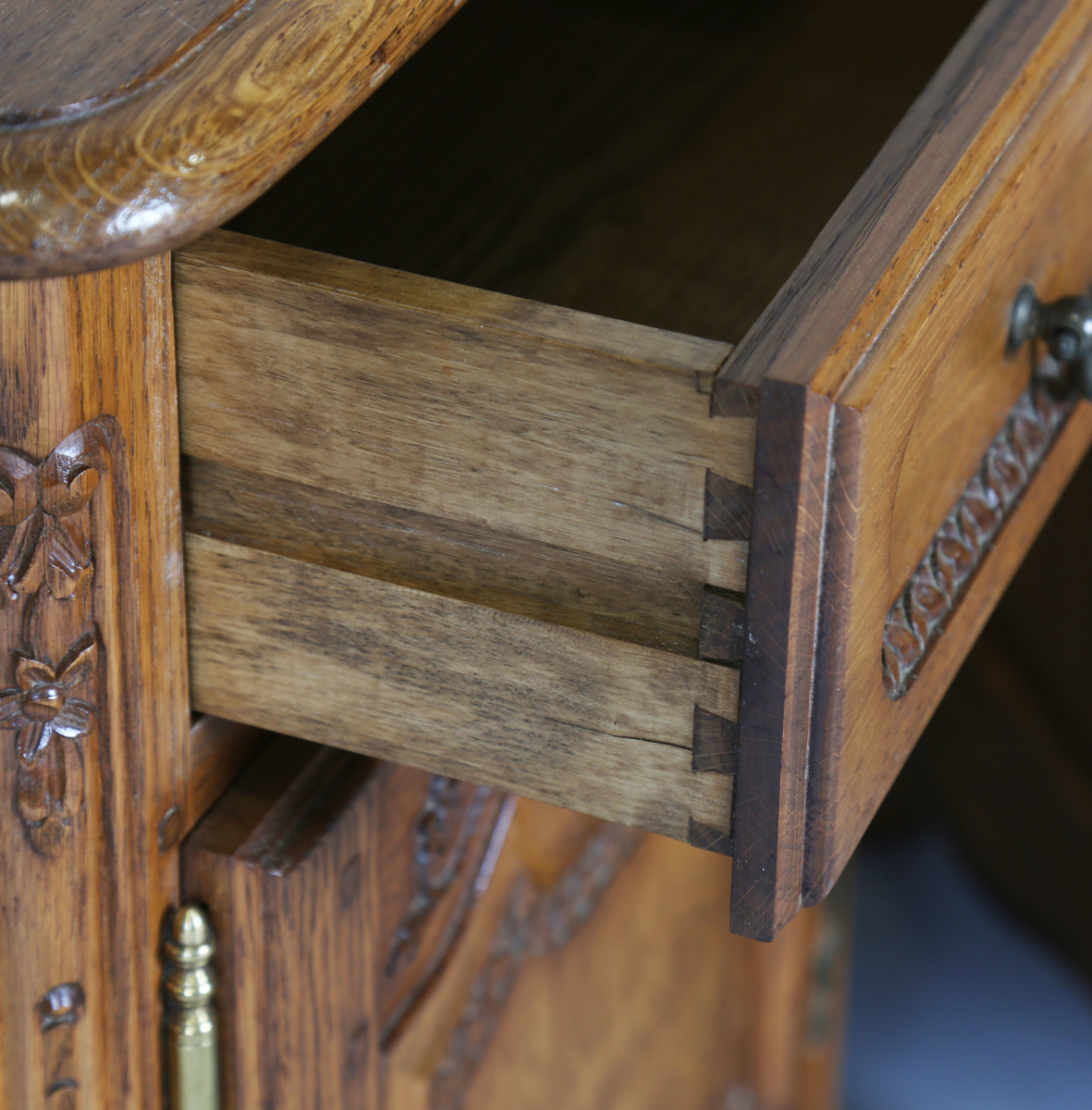 A pair of late 20th century French oak bedside cabinets, each fitted with a finely carved drawer and - Image 16 of 17