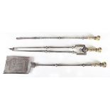 A set of three George III steel and brass fire tools with acanthus leaf cast knop handles above