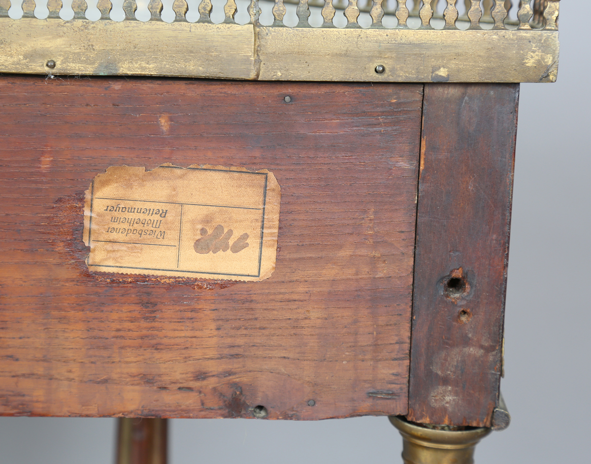 A French Empire mahogany and gilt metal mounted console table, the shaped top inset with white - Image 3 of 20