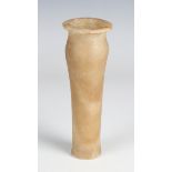 An Egyptian turned alabaster vessel of slightly swollen shouldered form, possibly a cosmetics or