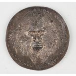 A rare silver medallion designed by Gerald Benney, circa 1972, obverse with gorilla framed by