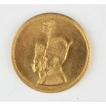 An Iran Pahlavi dynasty Mohammad Reza Shah (1941-1979) gold medallion celebrating his coronation