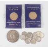 Two Elizabeth II gold medals commemorating the Silver Jubilee, each cased, together with a