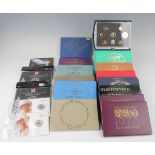 A group of Royal Mint year-type specimen/presentation coin sets, together with a small group of