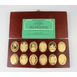 A set of twelve Elizabeth II silver gilt oval ingots commemorating the Arms of the Prince and