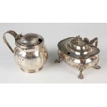 A George III silver mustard of cushion form with hinged lid, foliate capped handle, gadrooned rim