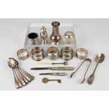 A set of six Edwardian silver teaspoons and pair of matching sugar tongs with engraved decoration,