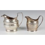 A George III silver oval milk jug with bright cut engraved decoration and loop handle, London 1796