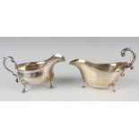 An Edwardian silver sauceboat with beaded rim and scroll handle on hoof feet, Chester 1909 by George