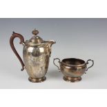 A George V silver hot water pot and matching two-handled sugar bowl, Birmingham 1928 and 1929 by