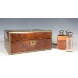 A Victorian walnut and brass bound vanity case with a hinged lid and fitted interior, width 30.