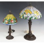 A modern Tiffany style bronze patinated metal table lamp with opaque stained and leaded glass shade,