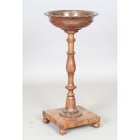 A William IV mahogany plant stand, the circular bowl top raised on a flower cusp stem and square