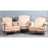 A pair of late 20th century French walnut showframe armchairs, upholstered in acorn and oak leaf