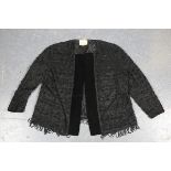 An early/mid-20th century black silk, net and velvet evening jacket with overall beaded appliqué,