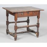A Charles II oak side table, the two-piece top with edged sides above a single drawer, raised on