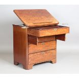 A late 18th/early 19th century mahogany gentleman's dressing chest/writing table, the hinged top